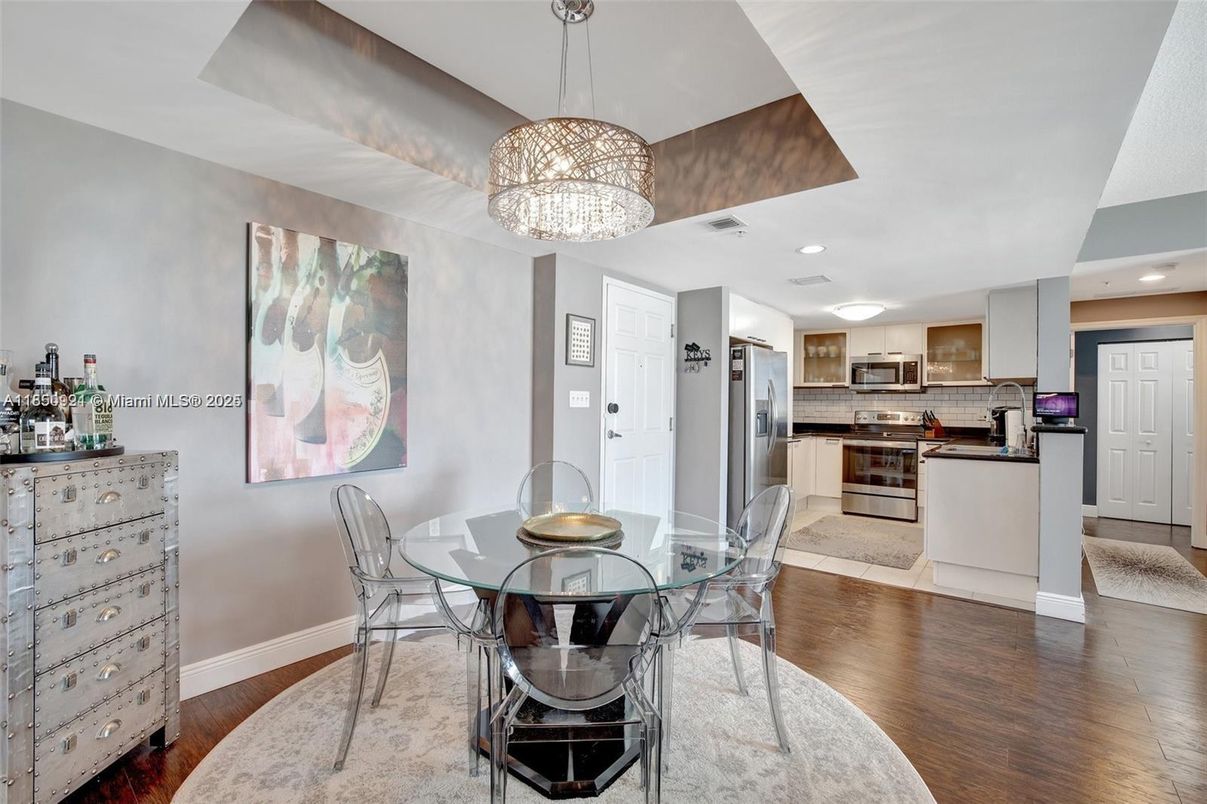 Chandelier, Dining room, Interior, Kitchen, Pendant Lights, Recessed Lighting, Stainless Steel Appliances, Wood Texture Flooring