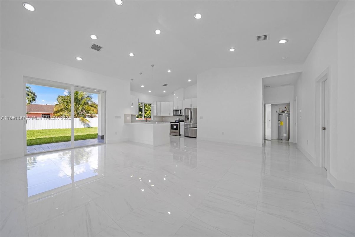 Empty room, Interior, Kitchen, Marble, Pendant Lights, Recessed Lighting, Stainless Steel Appliances