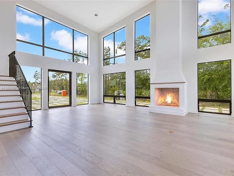 Fireplace, Interior, Recessed Lighting, Sun Room, Wood Texture Flooring