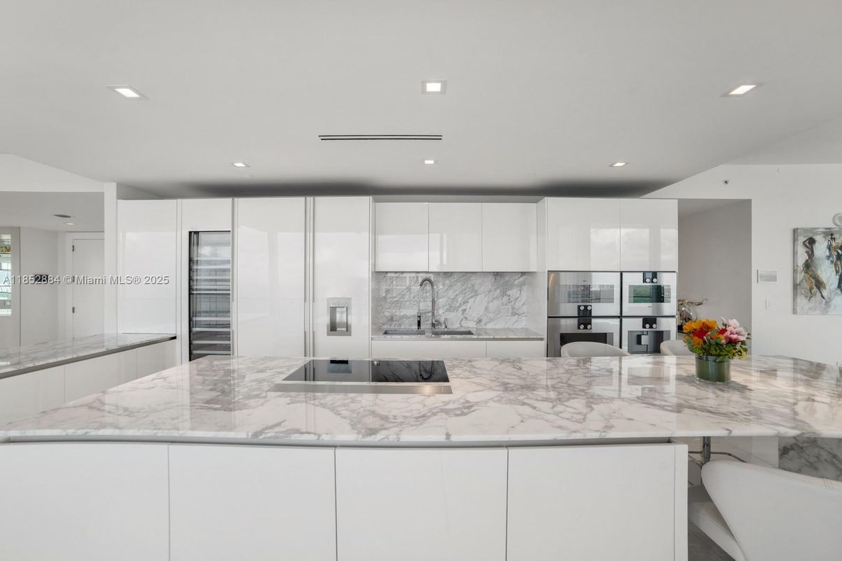 Interior, Kitchen, Marble Walls, Recessed Lighting, Stainless Steel Appliances