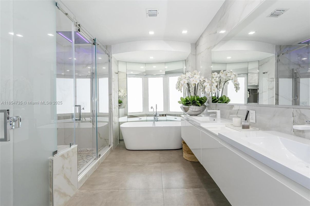 Bathroom, Dual Sink Vanities, Free Standing Baths, Glass Shower, Interior, Marble Walls, Recessed Lighting