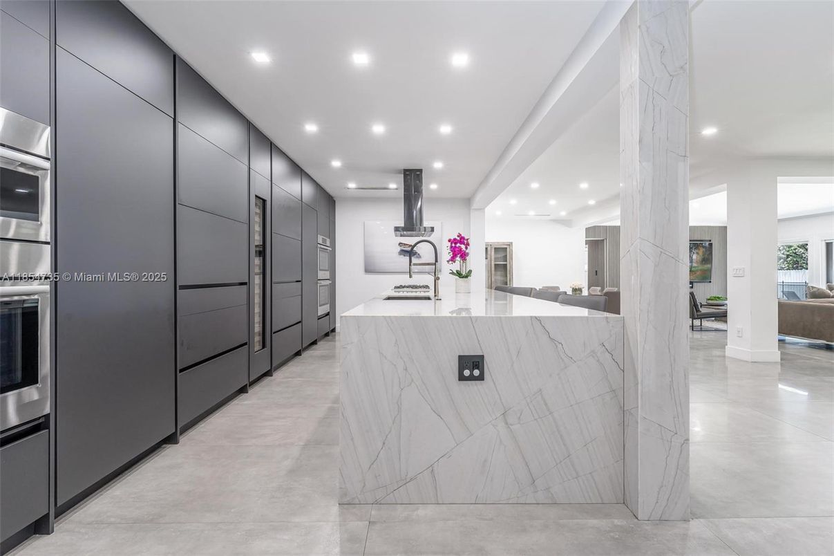 Interior, Kitchen, Marble Walls, Recessed Lighting, Stainless Steel Appliances