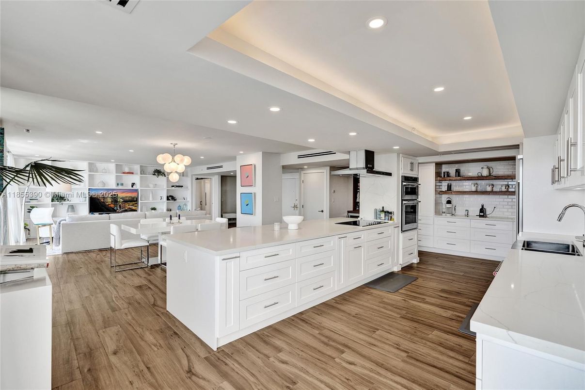 Chandelier, Dining room, Interior, Kitchen, Living room, Pendant Lights, Recessed Lighting, Stainless Steel Appliances, Wood Texture Flooring