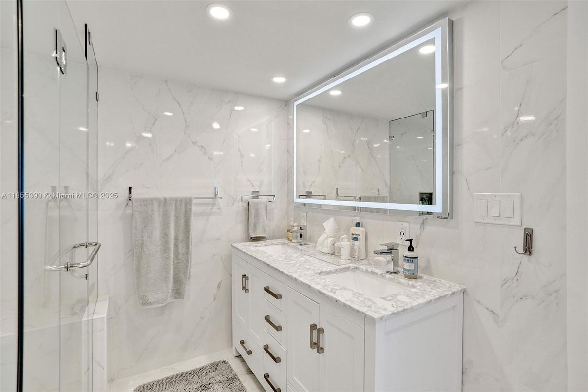 Bathroom, Dual Sink Vanities, Glass Shower, Interior, Marble Walls, Recessed Lighting