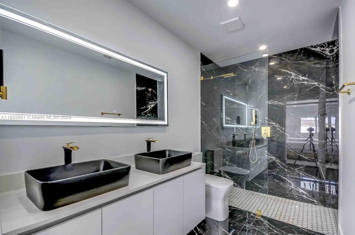 Bathroom, Dual Sink Vanities, Glass Shower, Interior, Marble, Marble Walls, Recessed Lighting
