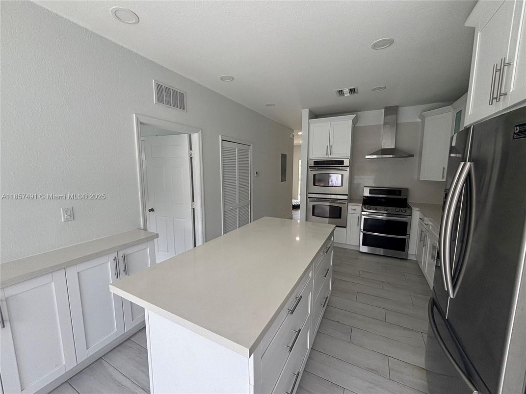 Interior, Kitchen, Recessed Lighting, Stainless Steel Appliances, Wood Texture Flooring