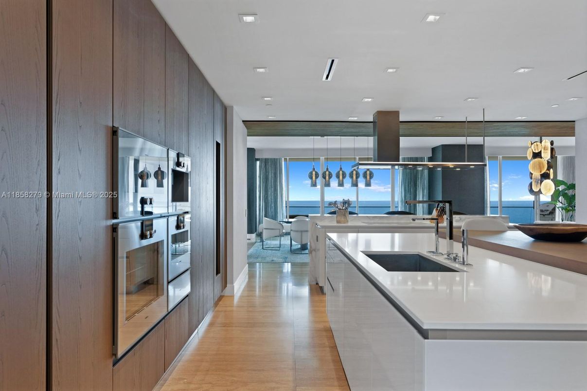 Dining room, Interior, Kitchen, Pendant Lights, Recessed Lighting, Stainless Steel Appliances, Water, Wood Texture Flooring