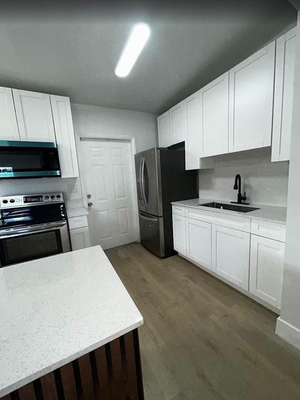 Interior, Kitchen, Recessed Lighting, Washer, Wood Texture Flooring