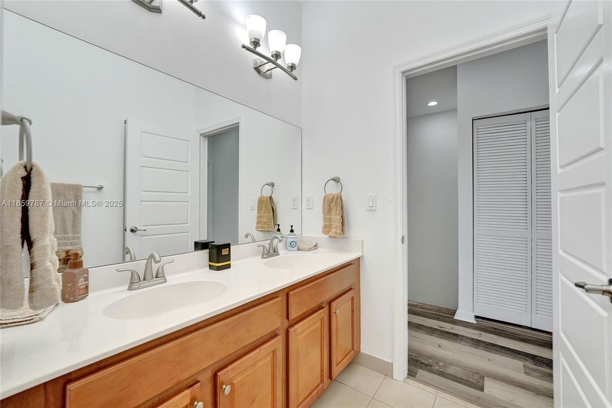 Bathroom, Dual Sink Vanities, Interior, Recessed Lighting, Wood Texture Flooring