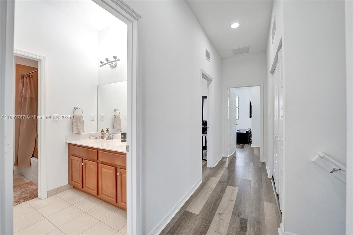 Bathroom, Dual Sink Vanities, Interior, Recessed Lighting, Wood Texture Flooring