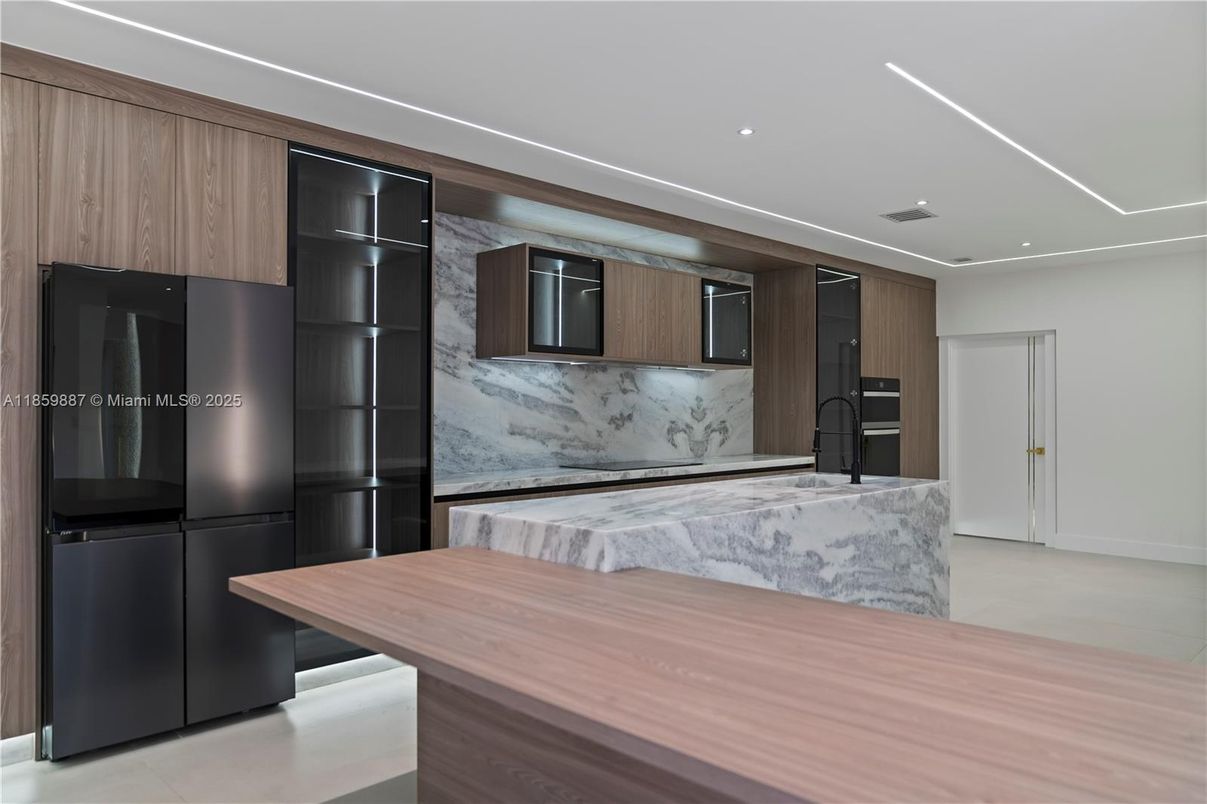 Interior, Kitchen, Marble Walls, Recessed Lighting, Stainless Steel Appliances