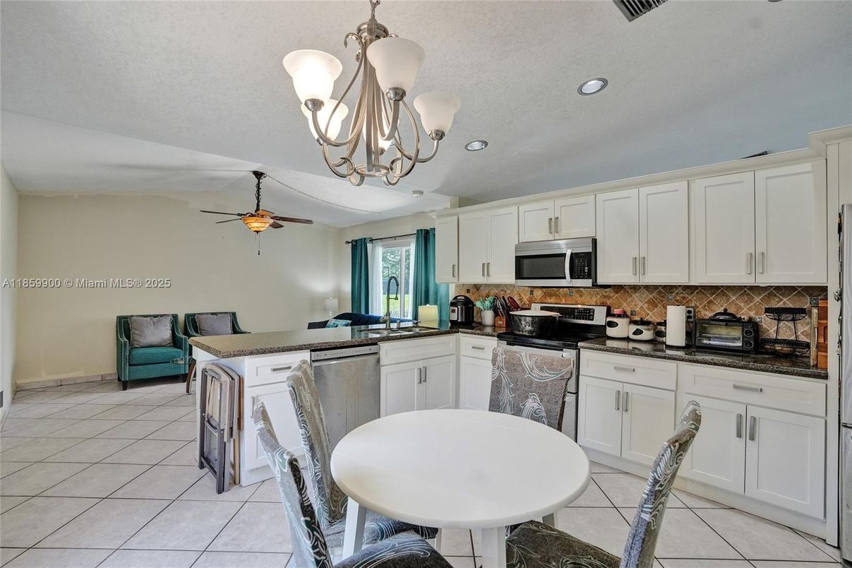 Chandelier, Dining room, Interior, Kitchen, Recessed Lighting, Stainless Steel Appliances