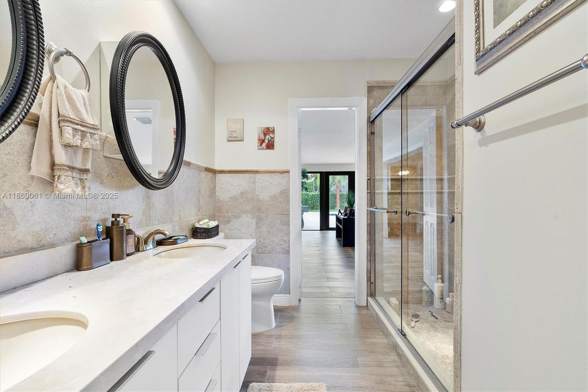 Bathroom, Dual Sink Vanities, Glass Shower, Interior, Recessed Lighting, Wood Texture Flooring