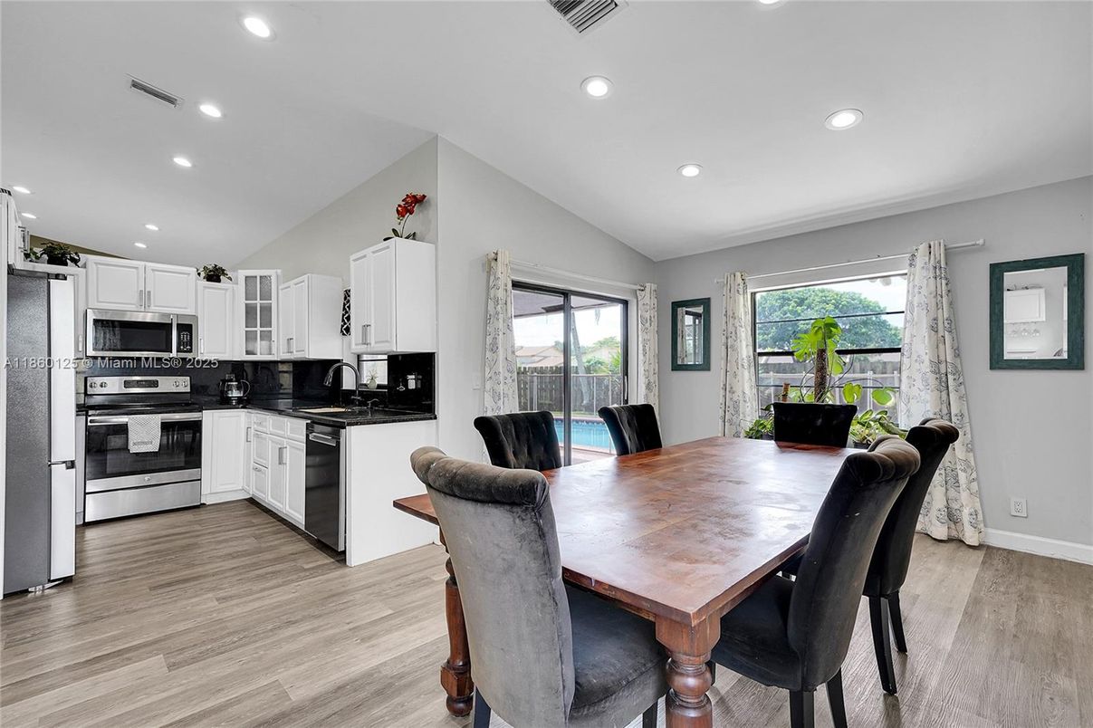 Dining room, Interior, Kitchen, Recessed Lighting, Stainless Steel Appliances, Wood Texture Flooring