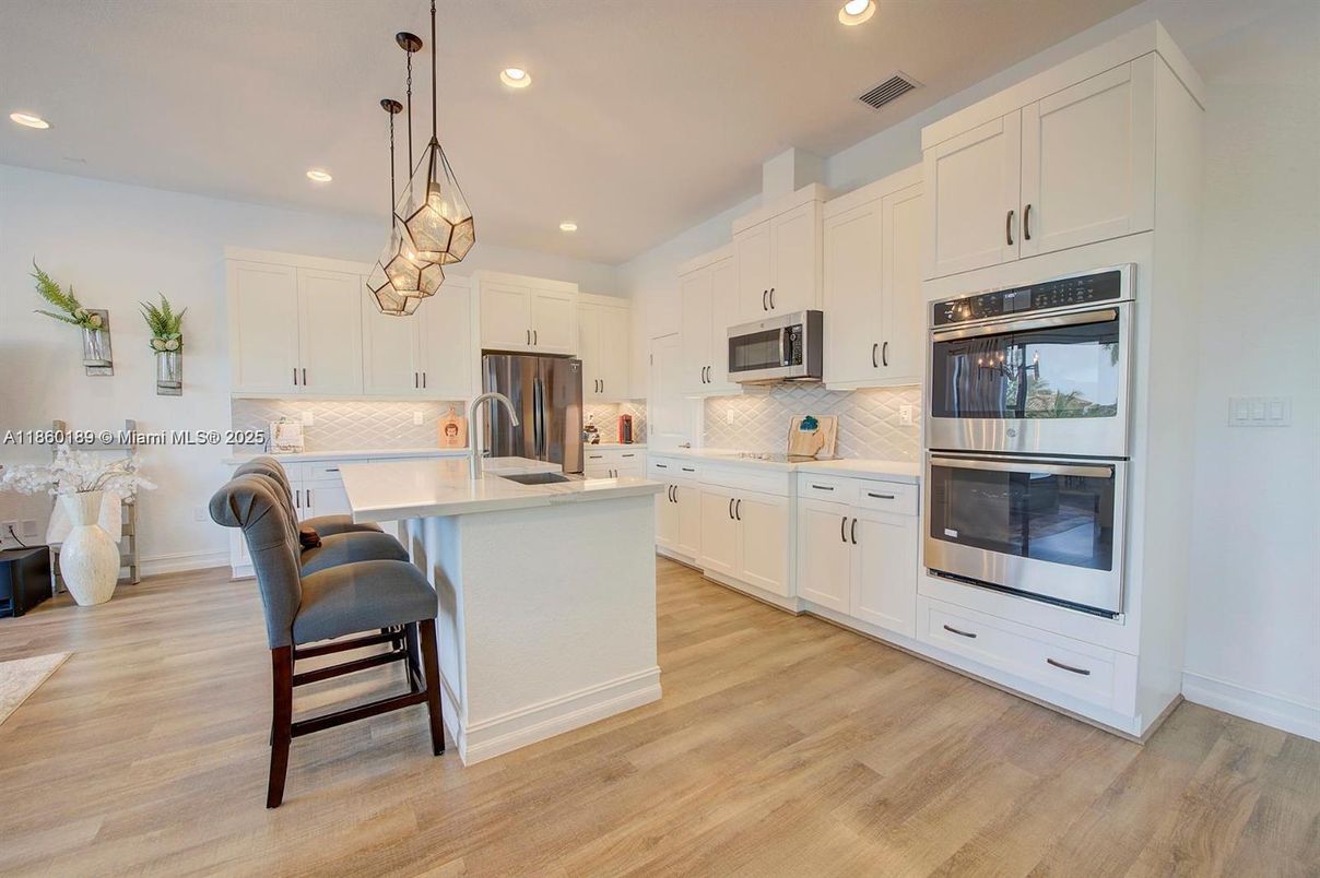 Interior, Kitchen, Pendant Lights, Recessed Lighting, Stainless Steel Appliances, Wood Texture Flooring