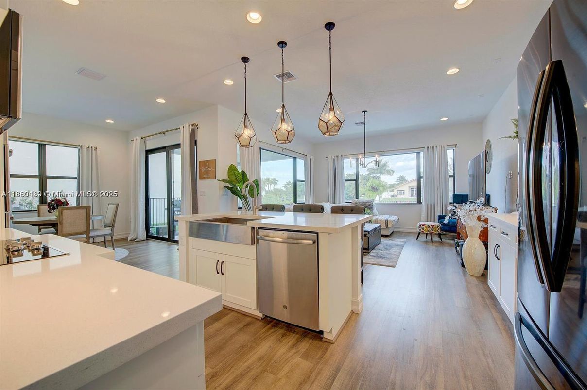 Dining room, Interior, Kitchen, Pendant Lights, Recessed Lighting, Stainless Steel Appliances, Wood Texture Flooring