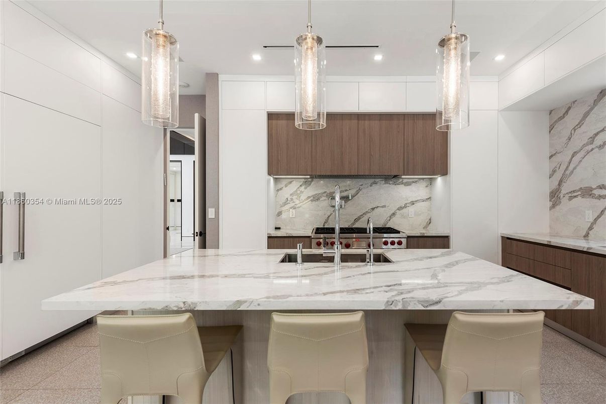 Interior, Kitchen, Marble Walls, Pendant Lights, Recessed Lighting, Stainless Steel Appliances
