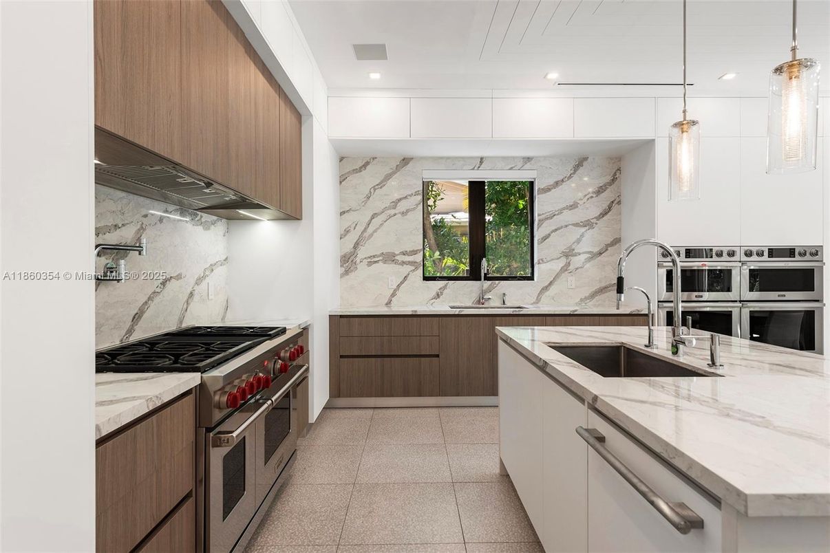 Interior, Kitchen, Marble Walls, Pendant Lights, Recessed Lighting, Stainless Steel Appliances