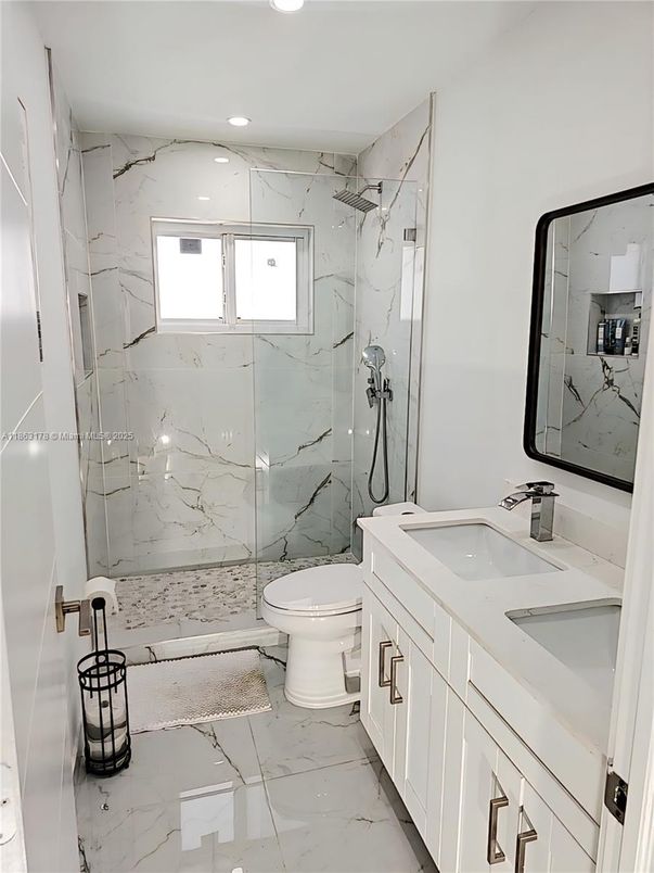 Bathroom, Dual Sink Vanities, Glass Shower, Interior, Marble, Marble Walls, Recessed Lighting