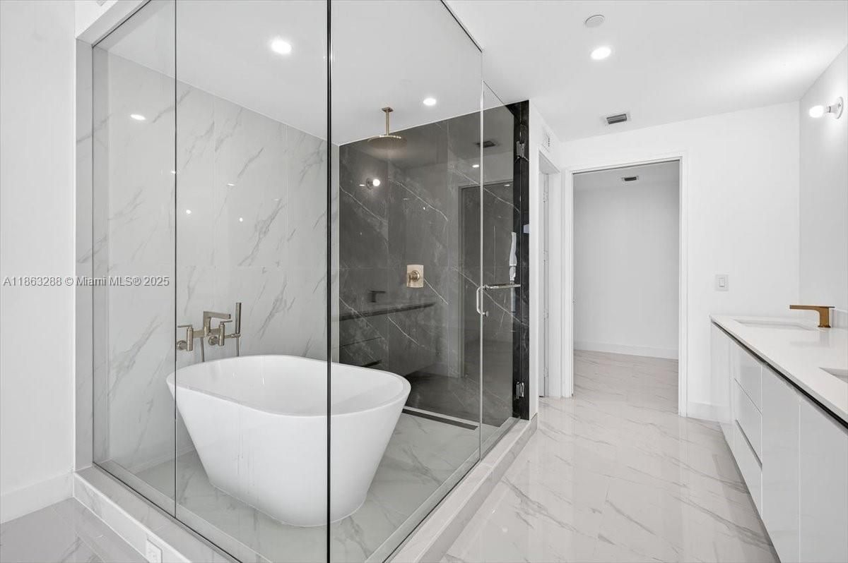 Bathroom, Free Standing Baths, Glass Shower, Interior, Marble, Marble Walls, Recessed Lighting