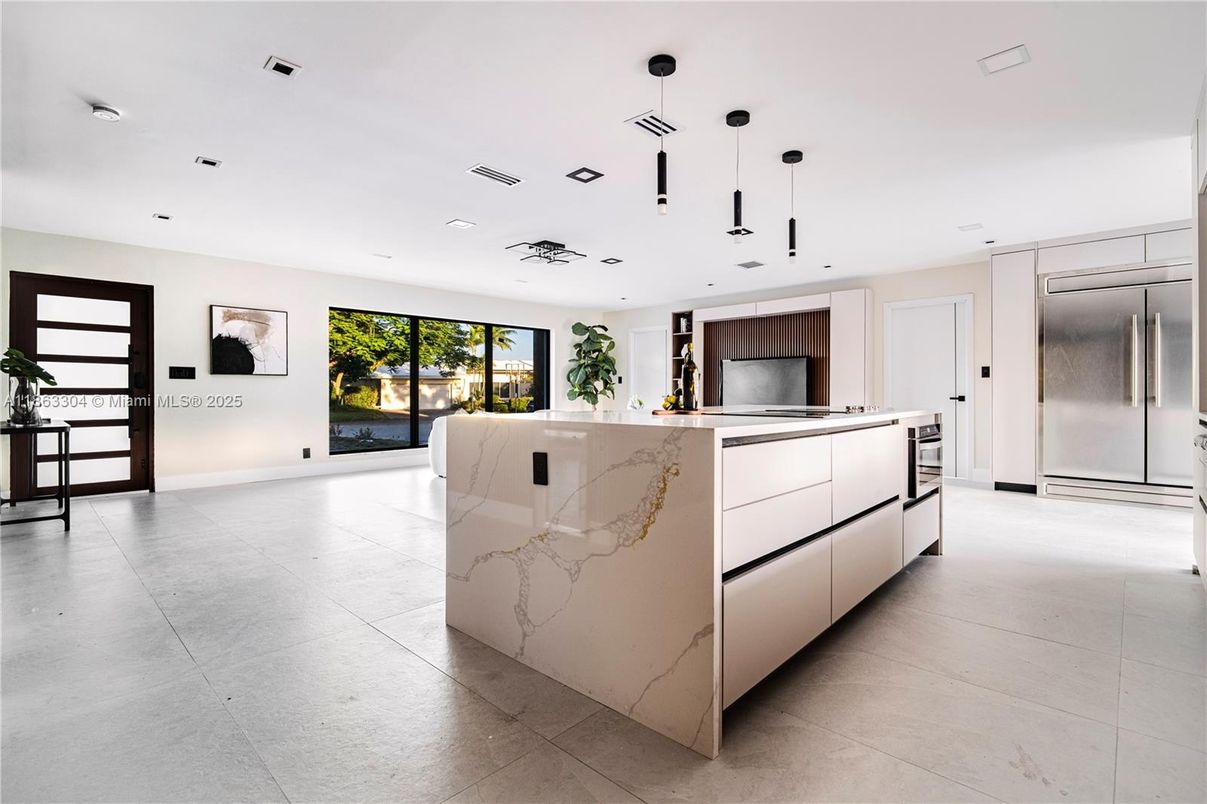 Interior, Kitchen, Marble Walls, Pendant Lights, Recessed Lighting, Stainless Steel Appliances