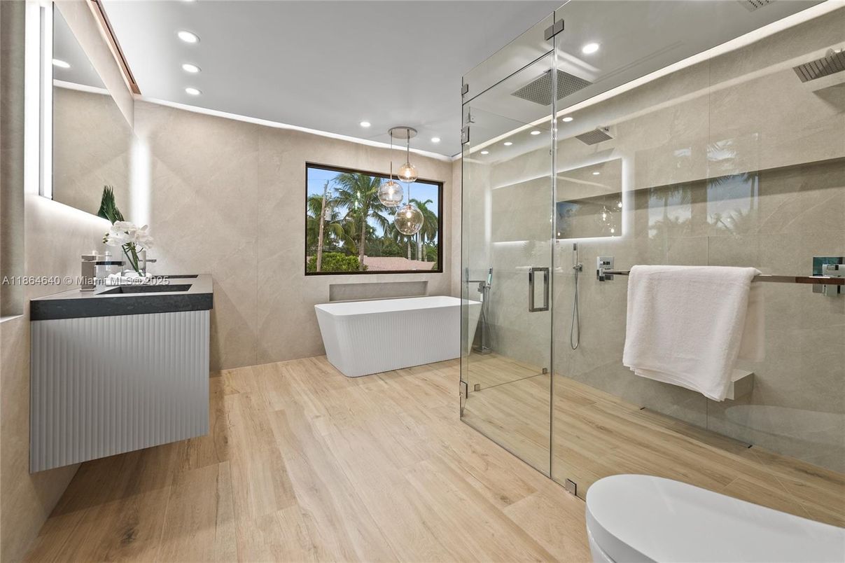 Bathroom, Free Standing Baths, Glass Shower, Interior, Pendant Lights, Recessed Lighting, Wood Texture Flooring