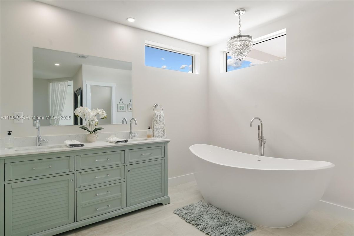 Bathroom, Chandelier, Dual Sink Vanities, Free Standing Baths, Interior, Pendant Lights, Recessed Lighting, Wood Texture Flooring