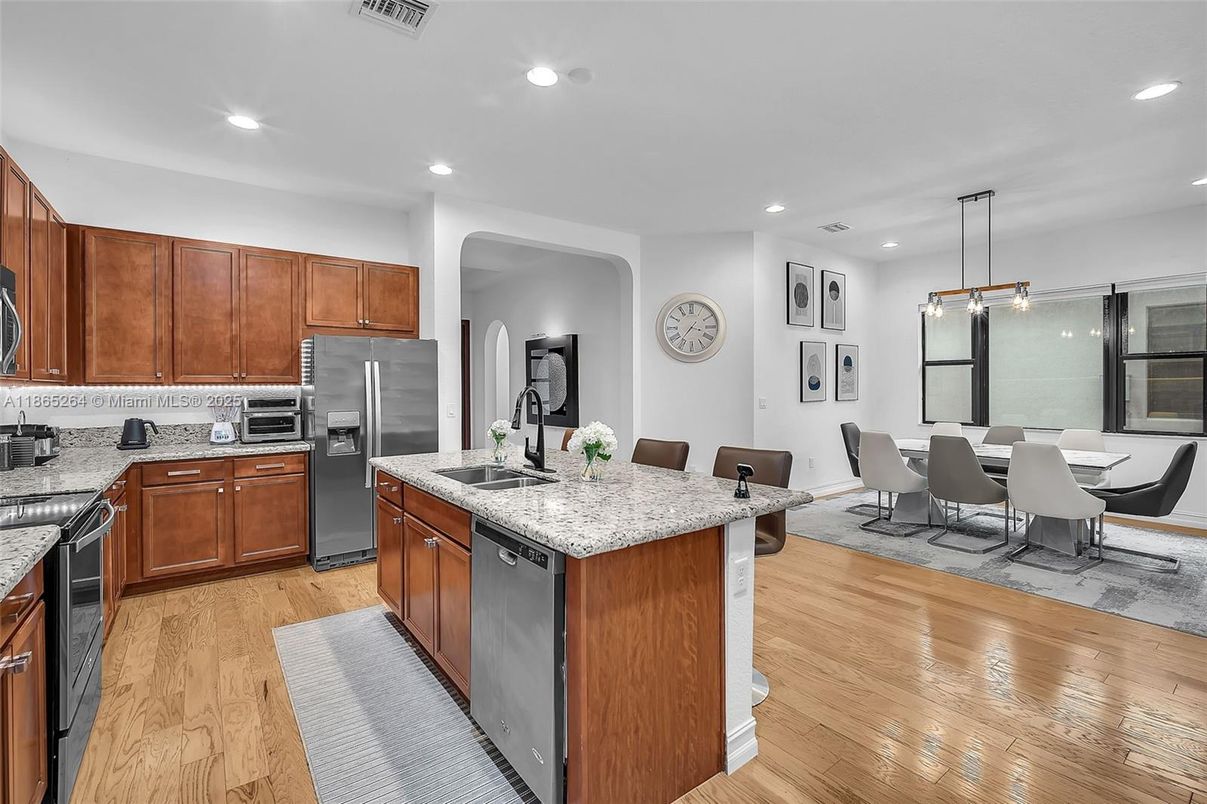 Dining room, Interior, Kitchen, Pendant Lights, Recessed Lighting, Stainless Steel Appliances, Wood Texture Flooring