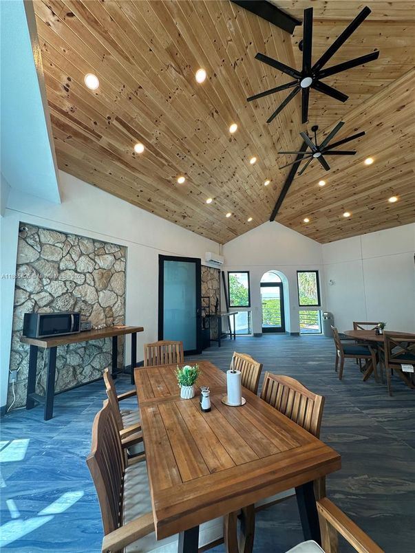 Dining room, Fireplace, Interior, Recessed Lighting, Stone Walls, Wooden Ceilings, Wood Texture Flooring