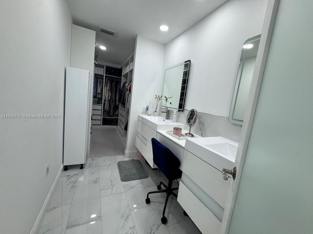 Bathroom, Dual Sink Vanities, Interior, Marble, Recessed Lighting, Walk-in Closets