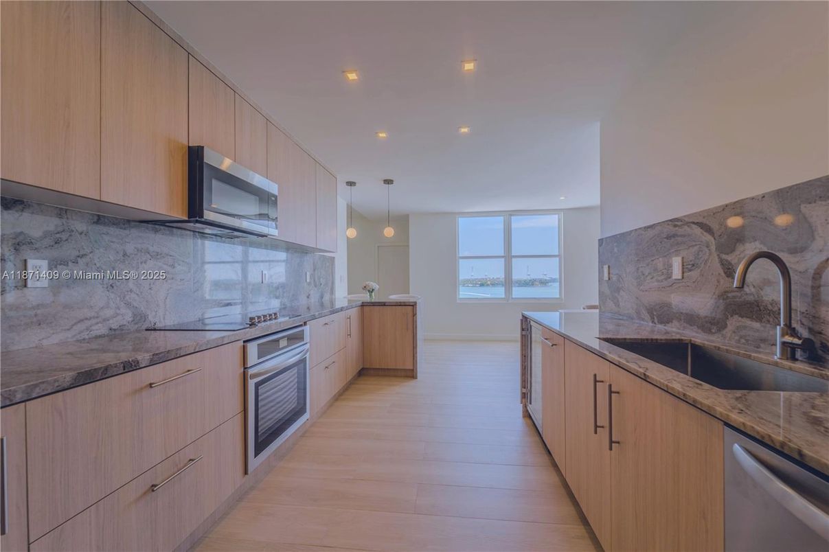 Interior, Kitchen, Marble Walls, Pendant Lights, Recessed Lighting, Stainless Steel Appliances, Water, Wood Texture Flooring