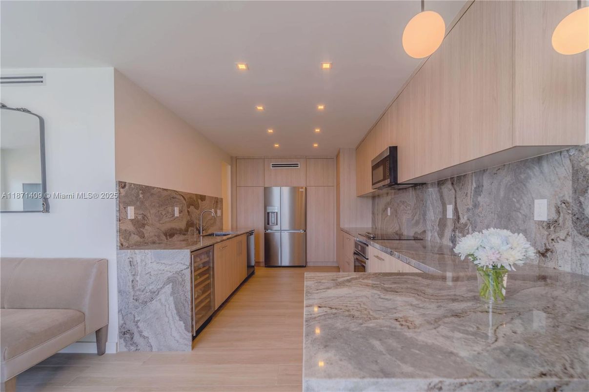 Interior, Kitchen, Marble Walls, Recessed Lighting, Stainless Steel Appliances, Wood Texture Flooring