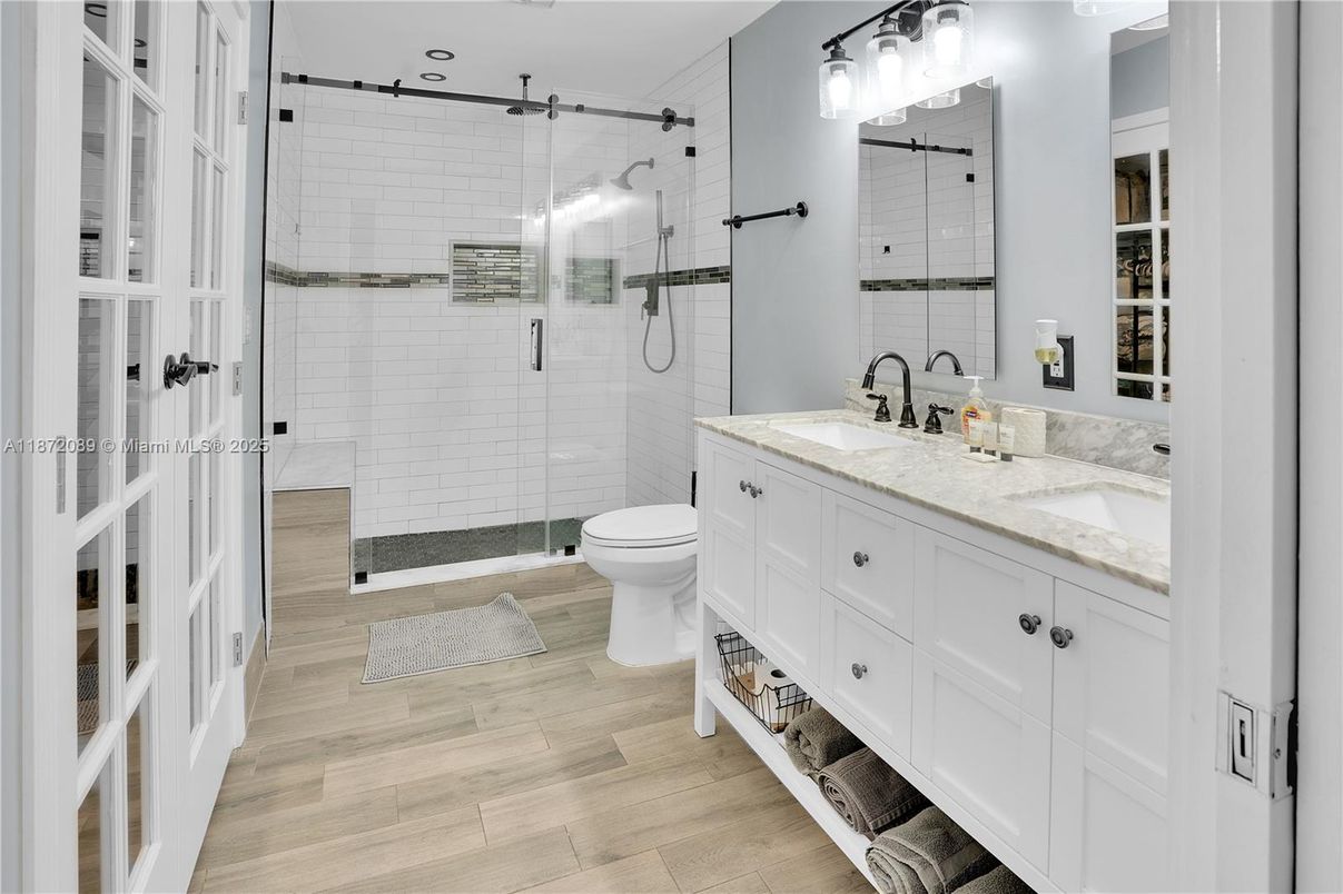 Bathroom, Dual Sink Vanities, Glass Shower, Interior, Wood Texture Flooring