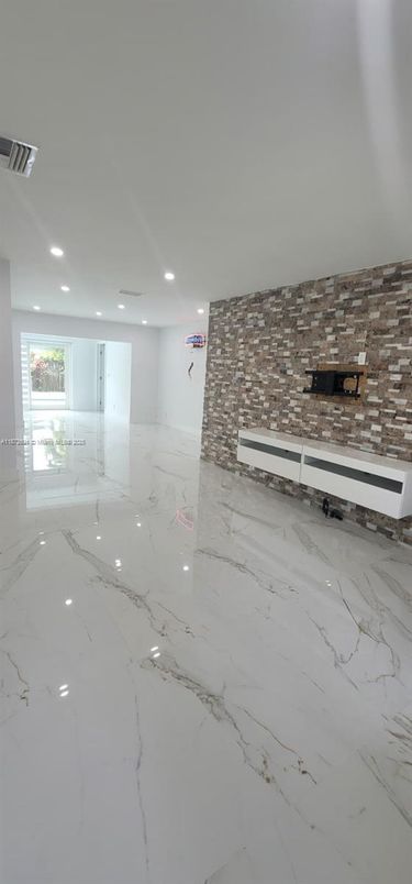 Empty room, Fireplace, Interior, Marble, Recessed Lighting, Stone Walls