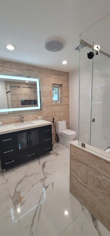 Bathroom, Glass Shower, Interior, Marble, Recessed Lighting, Stone Walls