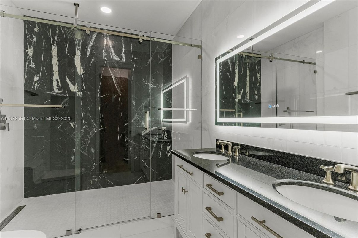 Bathroom, Dual Sink Vanities, Glass Shower, Interior, Marble Walls, Recessed Lighting