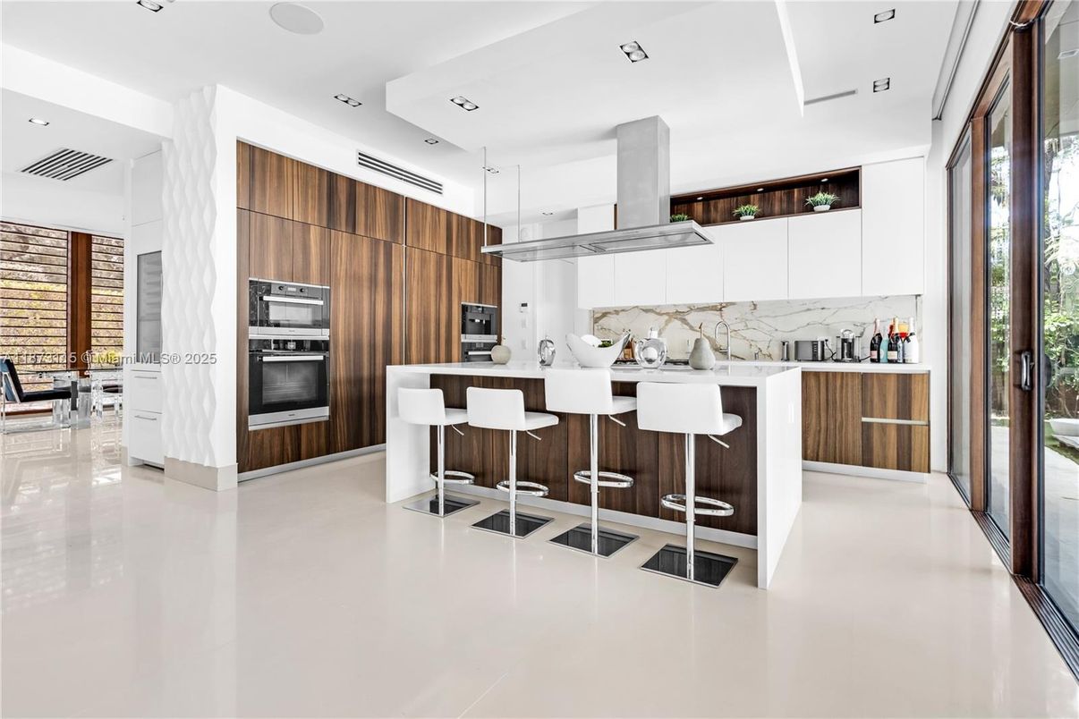 Interior, Kitchen, Marble Walls, Recessed Lighting, Stainless Steel Appliances