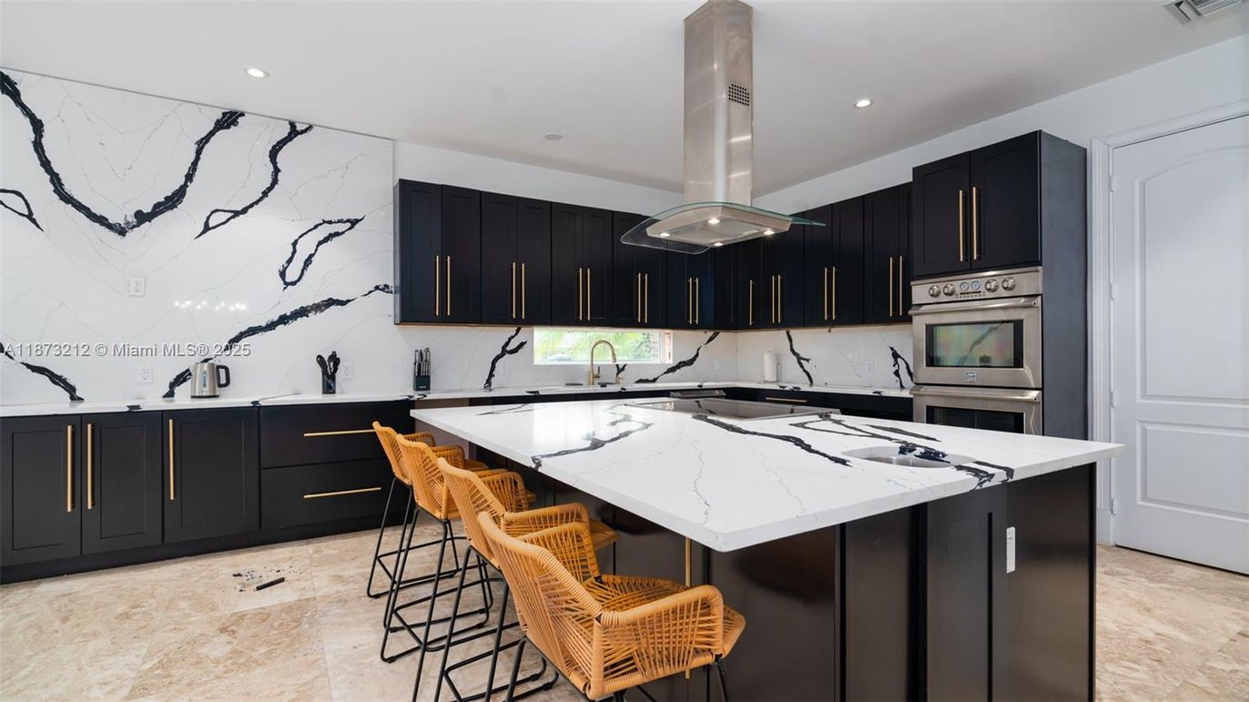 Interior, Kitchen, Marble Walls, Recessed Lighting, Stainless Steel Appliances