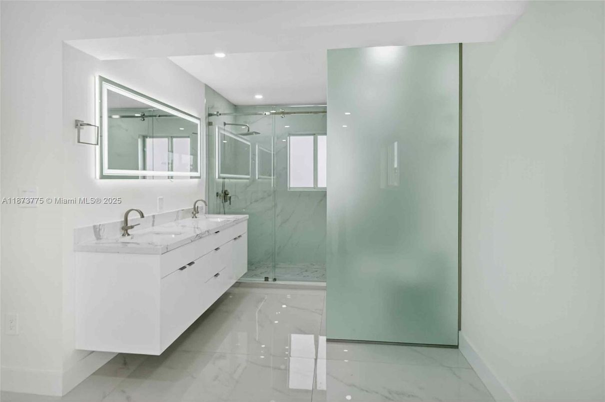 Bathroom, Dual Sink Vanities, Glass Shower, Interior, Marble, Marble Walls, Recessed Lighting