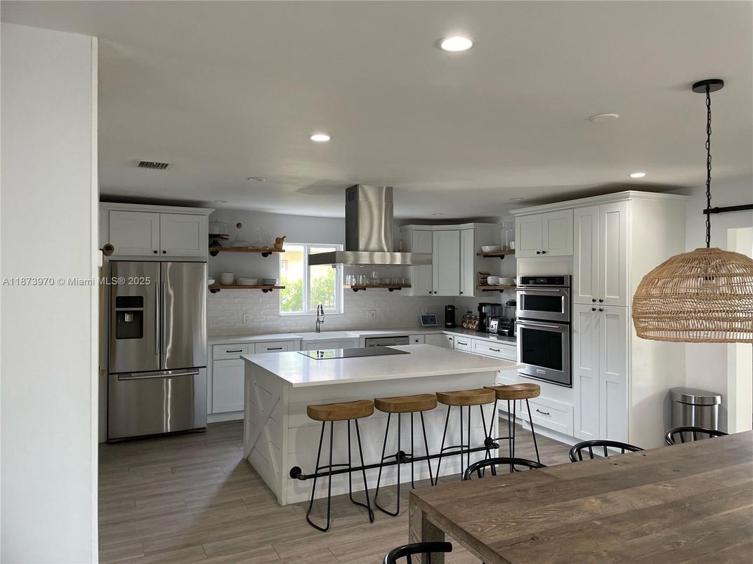 Interior, Kitchen, Pendant Lights, Recessed Lighting, Stainless Steel Appliances, Wood Texture Flooring