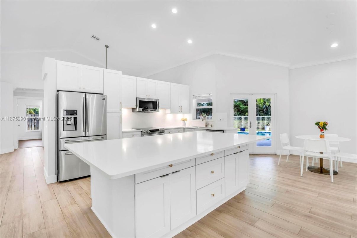 Dining room, Interior, Kitchen, Recessed Lighting, Stainless Steel Appliances, Wood Texture Flooring