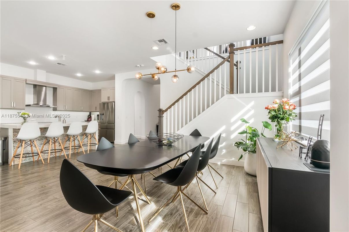 Dining room, Interior, Kitchen, Pendant Lights, Recessed Lighting, Stainless Steel Appliances, Wood Texture Flooring