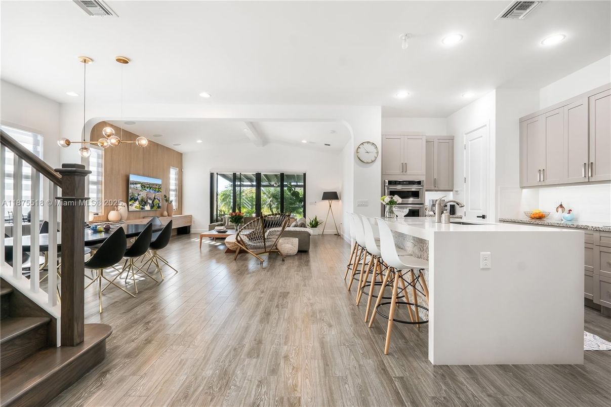 Dining room, Interior, Kitchen, Living room, Pendant Lights, Recessed Lighting, Stainless Steel Appliances, Wood Texture Flooring