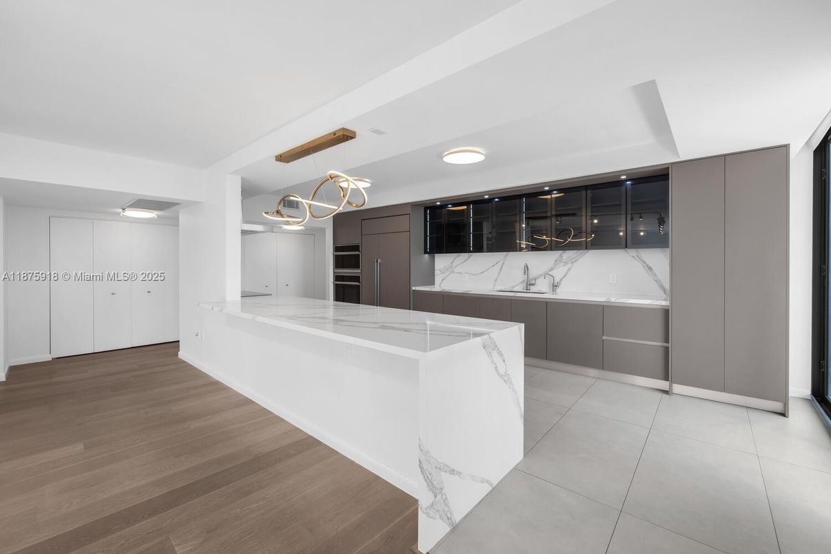 Interior, Kitchen, Marble Walls, Pendant Lights, Recessed Lighting, Wood Texture Flooring
