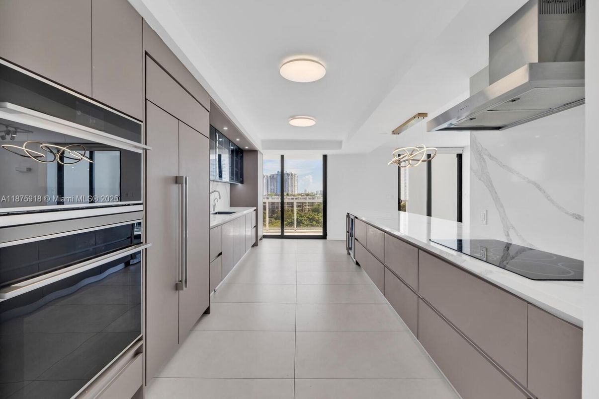 Interior, Kitchen, Marble Walls, Recessed Lighting, Stainless Steel Appliances