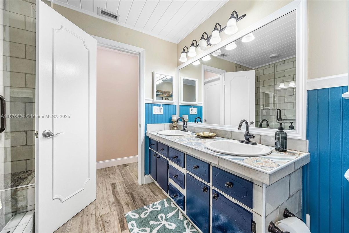 Bathroom, Dual Sink Vanities, Glass Shower, Interior, Tile Countertops, Wood Texture Flooring