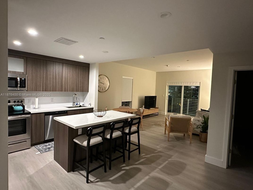 Dining room, Interior, Kitchen, Recessed Lighting, Stainless Steel Appliances, Wood Texture Flooring