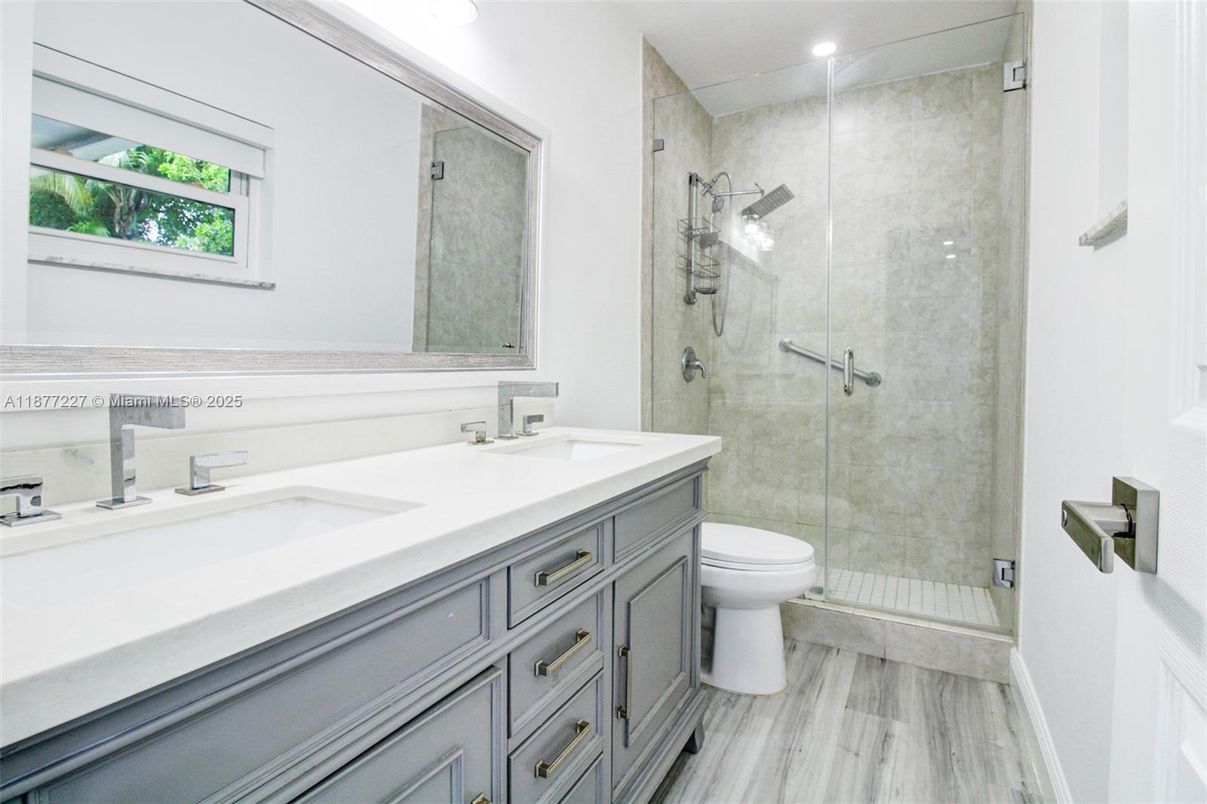Bathroom, Dual Sink Vanities, Glass Shower, Interior, Recessed Lighting, Wood Texture Flooring