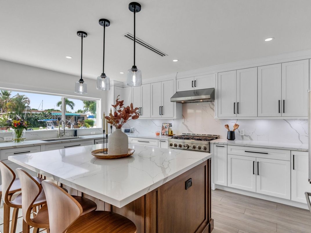 Interior, Kitchen, Marble Walls, Pendant Lights, Recessed Lighting, Stainless Steel Appliances, Wood Texture Flooring