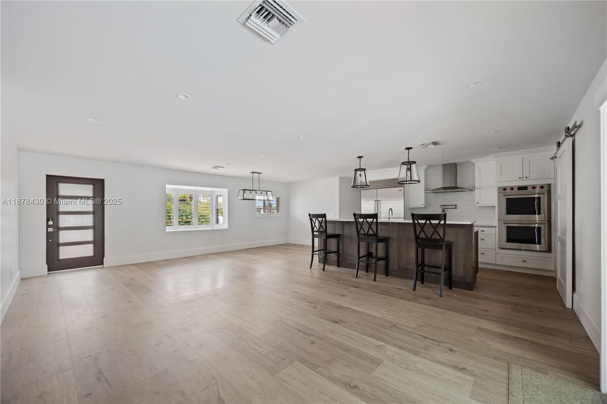 Dining room, Interior, Kitchen, Pendant Lights, Recessed Lighting, Stainless Steel Appliances, Wood Texture Flooring